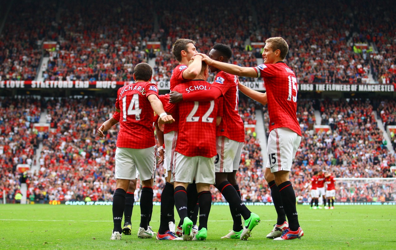 Manchester Unitedin pelaajat juhlivat maalia Wigania vastaan